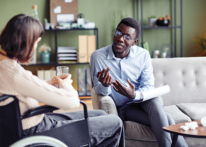 A clinician and client in a warm conversation